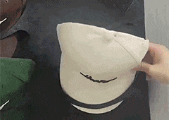 Hanging hat holder with multiple pockets